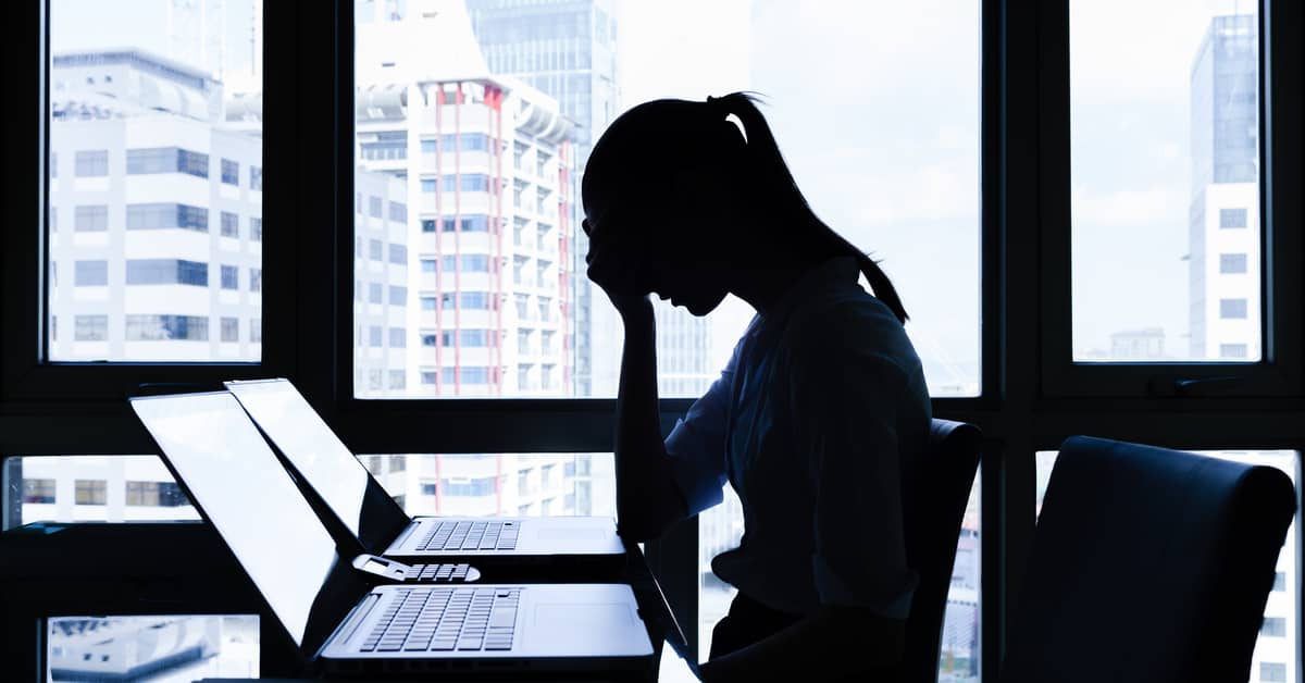 employer-at-desk-considering-the-cost-of-employee-mental-health-in-the-workplace